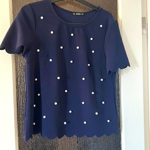 Pearl shirt with scalloped edges